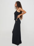   side view of model wearing Princess Polly Nesting Maxi Skirt Black Maxi 