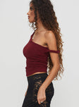 side view of model wearing Princess Polly Messenger One Shoulder Top Burgundy Sleeveless Asymmetric Neckline 