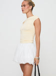   side view of model wearing Princess Polly Anglaise Bubble Hem Mini Skirt White Mini Skirts 