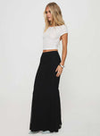   side view of model wearing Princess Polly Topping Maxi Skirt Black Tall Maxi 