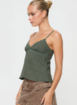 side view of model wearing Princess Polly Lunya Top Green Sleeveless V-Neck 