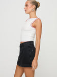 side view of model wearing Princess Polly Gazelle Denim Skort Washed Black High Waisted Shorts 