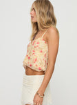 side view of model wearing Princess Polly Niklaus Top Cream Floral Sleeveless V-Neck 