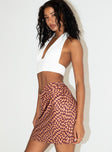   side view of model wearing Princess Polly Meredith Swirl Wrap Mini Skirt 