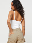 side view of model wearing Princess Polly Linden Bodysuit White Sleeveless Scoop Neck 