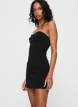 side view of model wearing Princess Polly Simple Sweetheart Mini Dress Black Sweetheart Neckline 