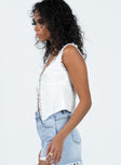 side view of model wearing Princess Polly Merrelle Top White Sleeveless Plunger 