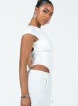 side view of model wearing Princess Polly Solita Bodysuit White Short Sleeves Boat Neck 