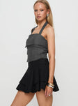   side view of model wearing Princess Polly Yeva Pleat Mini Skirt Black Mini Skirts 