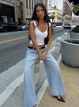 side view of model wearing Princess Polly Ramos Low Rise Denim Jeans Light Wash Petite Low Rise Jeans 