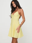 side view of model wearing Princess Polly Webbs Mini Dress Yellow Plunger 