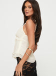 side view of model wearing Princess Polly Taini Top Cream Sleeveless Plunger 