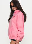 side view of model wearing Princess Polly Princess Polly Hooded Sweatshirt Bubble Text Pink / Red 