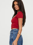 side view of model wearing Princess Polly Back In Time Short Sleeve Top Red Short Sleeves Square Neck 