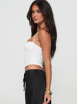 side view of model wearing Princess Polly Silverdale Top White Sleeveless Sweetheart 