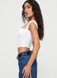 side view of model wearing Princess Polly Candyce Top White Sleeveless Sweetheart 