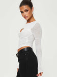 side view of model wearing Princess Polly Sandrine Twist Long Sleeve Top White Full Sleeves Scoop Neck 