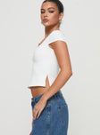 side view of model wearing Princess Polly Rehna Short Sleeve Top White Short Sleeves V-Neck 