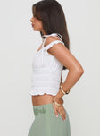 side view of model wearing Princess Polly Xavan Top White Short Sleeves straight 