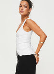 side view of model wearing Princess Polly Spirito Vest Top White Sleeveless Square Neck 