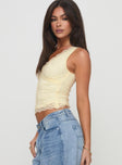 Front view of model wearing  front Princess Polly Sleeveless Asymmetric Neckline  Far Away Top Yellow