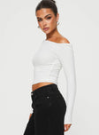 side view of model wearing Princess Polly Malian Long Sleeve Top White Full Sleeves Asymmetric Neckline 