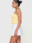 side view of model wearing Princess Polly Reema Skort White High Waisted Shorts 