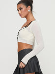 side view of model wearing Princess Polly Chacklie Two-piece Top Cream Full Sleeves Scoop Neck 