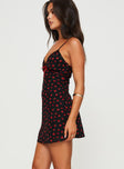 side view of model wearing Princess Polly Karena Mini Dress Black / Red Floral Plunger 