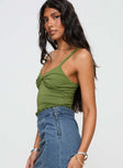 side view of model wearing Princess Polly Greyer Top Green Sleeveless Plunger 