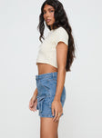   side view of model wearing Princess Polly Chillders Denim Mini Skirt Mid Wash Tall Mini Skirts 