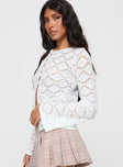 side view of model wearing Princess Polly Streep Crochet Top White Full Sleeves Crew Neck 