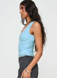 side view of model wearing Princess Polly Far Away Top Blue Sleeveless V-Neck 