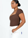 side view of model wearing Princess Polly Nolan Short Sleeve Bodysuit Brown Short Sleeves Scoop Neck 