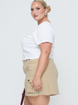   side view of model wearing Princess Polly Lydie Cargo Mini Skirt Beige Curve Mini Skirts 