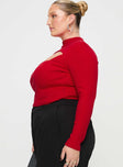 side view of model wearing Princess Polly Cathey Long Sleeve Corset Top Red Curve Full Sleeves High Neck 