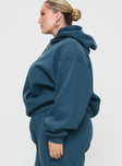 side view of model wearing Princess Polly Princess Polly Hooded Sweatshirt Block / Cursive Text Slate Curve 