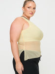 side view of model wearing Princess Polly Gilda Asymmetric Top Cream Curve Sleeveless Asymmetric Neckline 