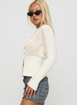 side view of model wearing Princess Polly Ethanne Knit Cardigan Cream Cropped 