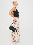   side view of model wearing Princess Polly Jodie Maxi Skirt Cream / Floral Maxi 