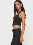 side view of model wearing Princess Polly Kimia Top Black / White Pinstripe Sleeveless Sweetheart 