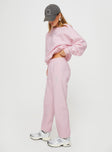 side view of model wearing Princess Polly Princess Polly Track Pants Script Baby Pink / Grey Mid Rise 