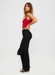 side view of model wearing Princess Polly Kinkirk Flared Pants Black Petite High Waisted Pants 