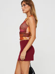   side view of model wearing Princess Polly Karley Low Waist Mini Skirt Burgundy Mini Skirts 