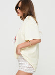 side view of model wearing Princess Polly Fresh Cherries Oversized Tee Yellow Half Sleeves Crew Neck 