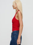 side view of model wearing Princess Polly Kingley Halter Top Red Sleeveless Plunger 