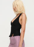 side view of model wearing Princess Polly Childers Halter Top Black Sleeveless Plunger 