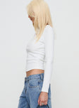 side view of model wearing Princess Polly Hopelessly Devoted Top White Full Sleeves Crew Neck 