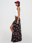   side view of model wearing Princess Polly Rhomana Maxi Skirt Black Floral Maxi 