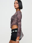 side view of model wearing Princess Polly Empty Space Top Leopard Full Sleeves Asymmetric Neckline 